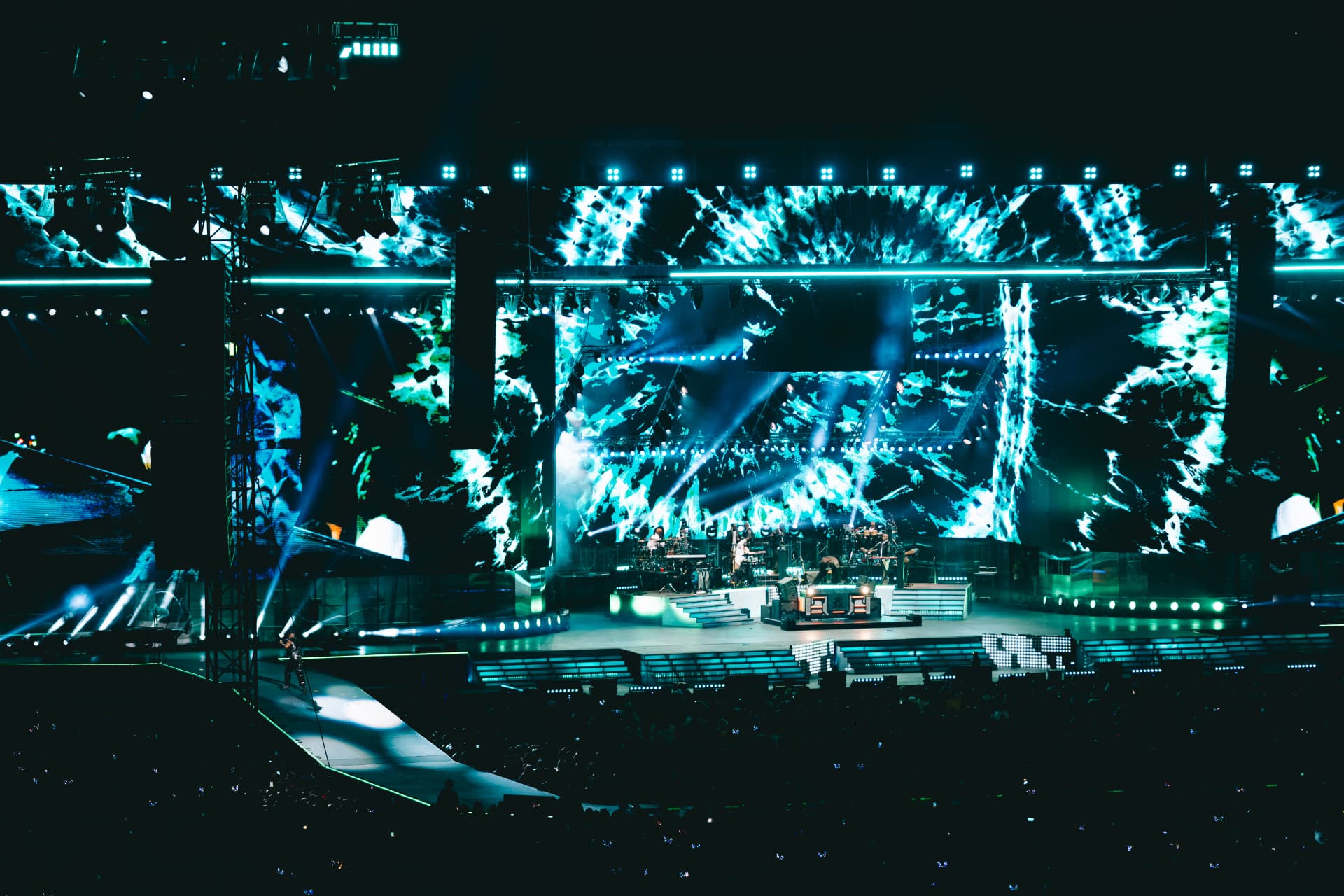 Wide shot of the full stage and packed stadium