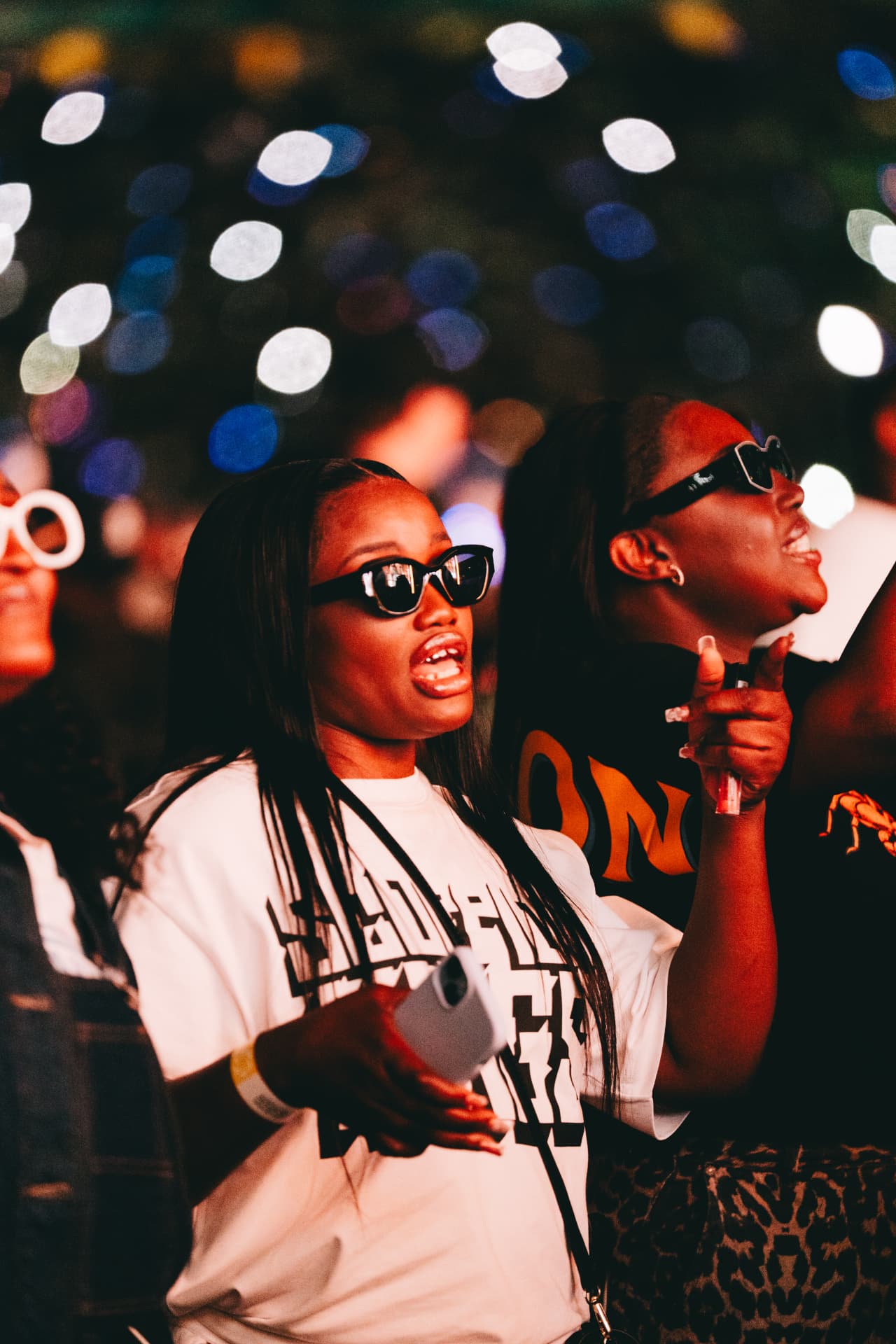 Fans singing along under the stadium lights