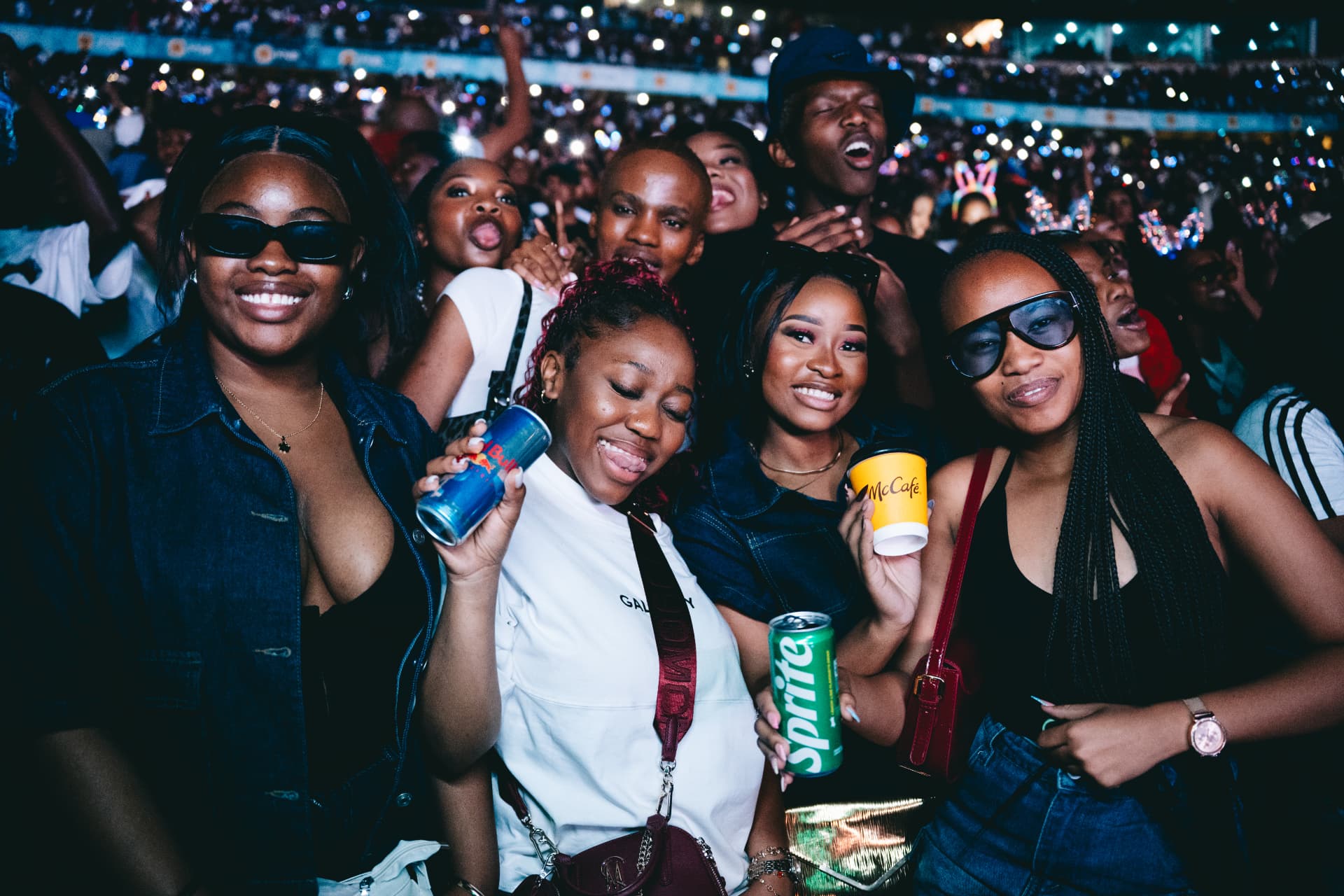 Friends enjoying Scorpion Kings Live in a packed stadium