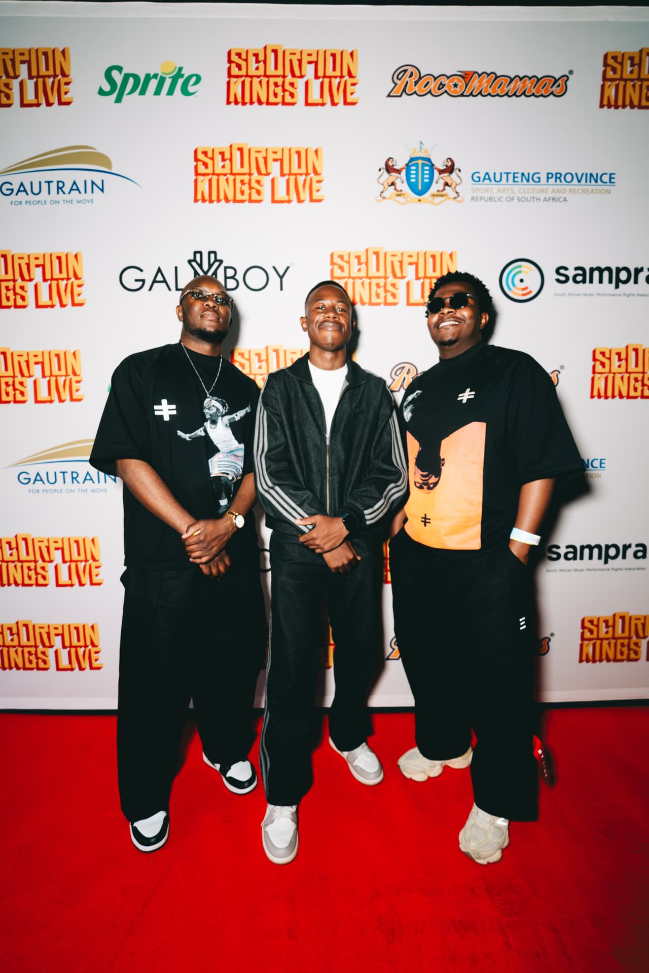 Three guests on the Scorpion Kings Live red carpet