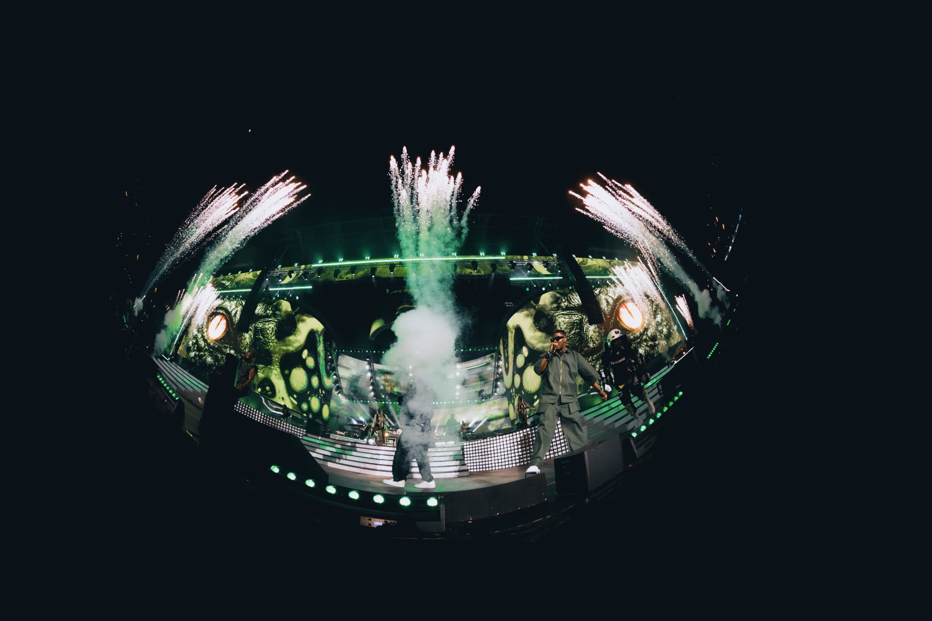 Pyrotechnics erupting above the stage